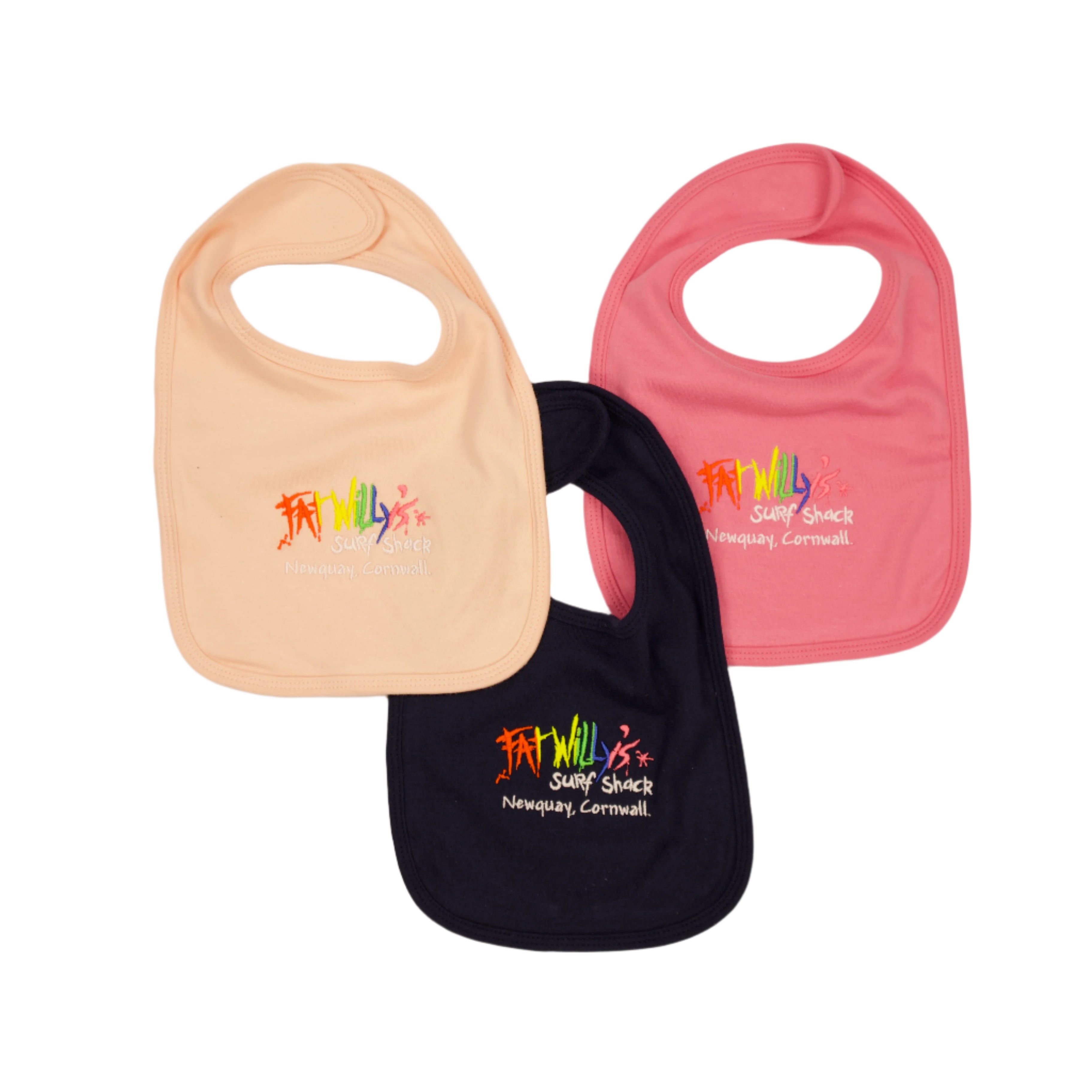 Three baby bibs in beige, pink, and navy with colorful text on a beige background