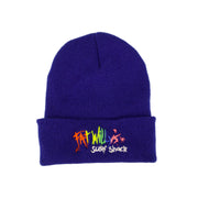 Blue beanie with colorful text on a beige background