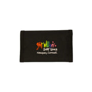 Black fabric with colorful embroidery on a beige background