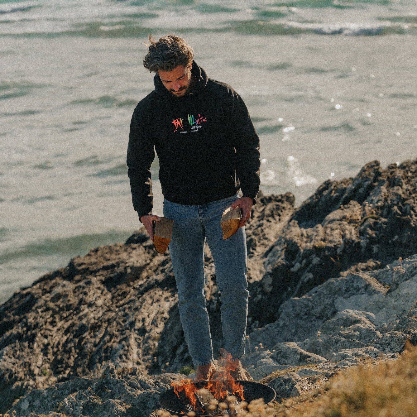 Model wearing Black Fat Willy’s hoodie outdoors with retro logo visible